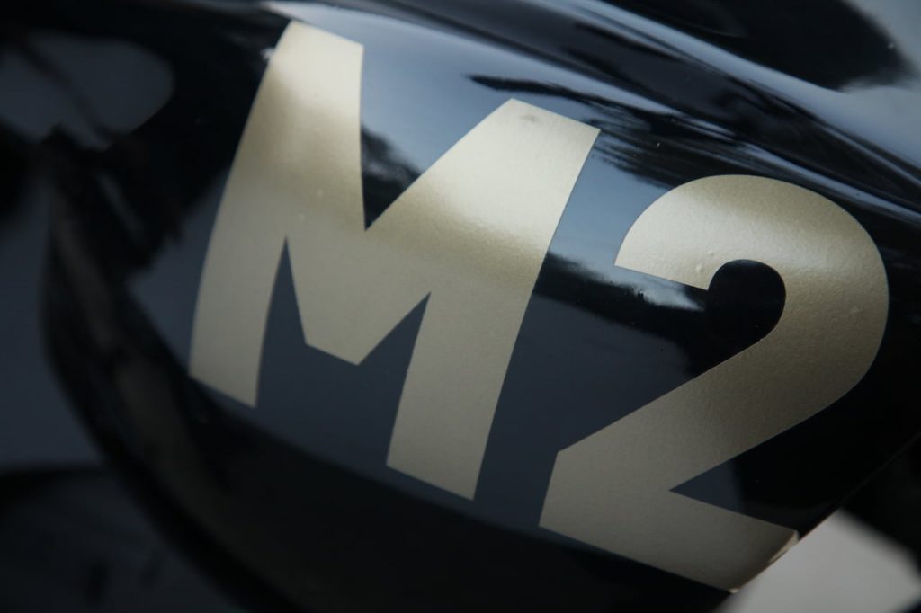 M2 electric bike M2 logo